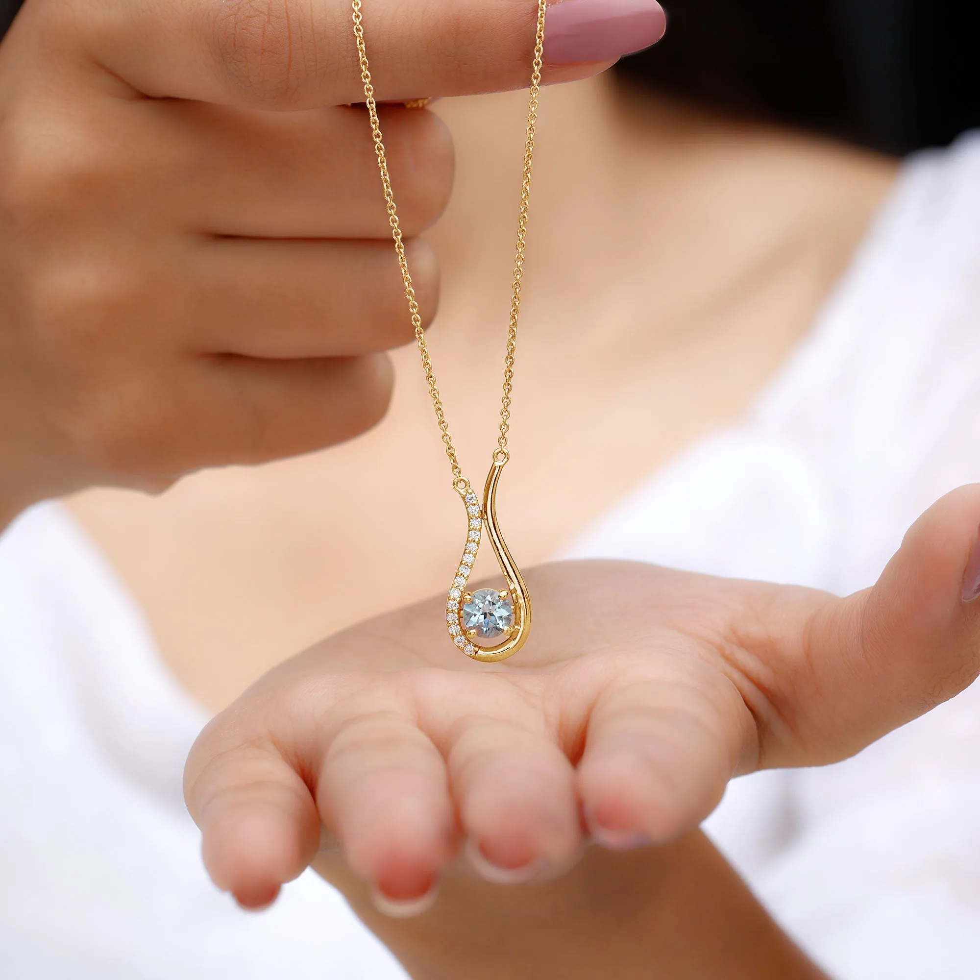 1 CT Sky Blue Topaz and Diamond Teardrop Pendant Necklace