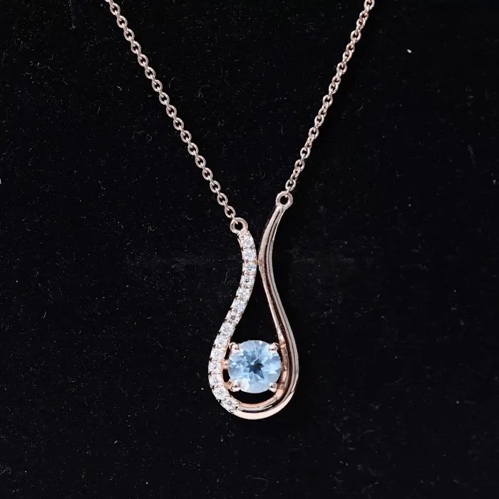 1 CT Sky Blue Topaz and Diamond Teardrop Pendant Necklace